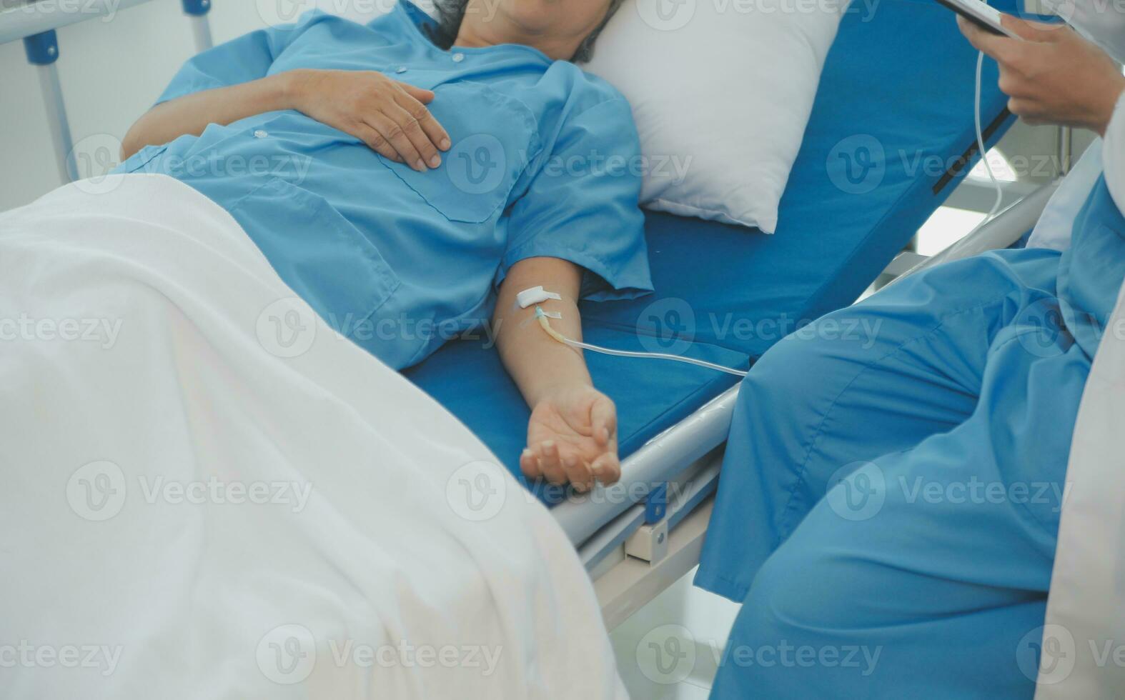 Doctor use stethoscope, checking up heart beat, lunch of auscultation in doctor office at hospital. Patient worker has to get medical checkup every year for her health or medical checkup cardiologist photo