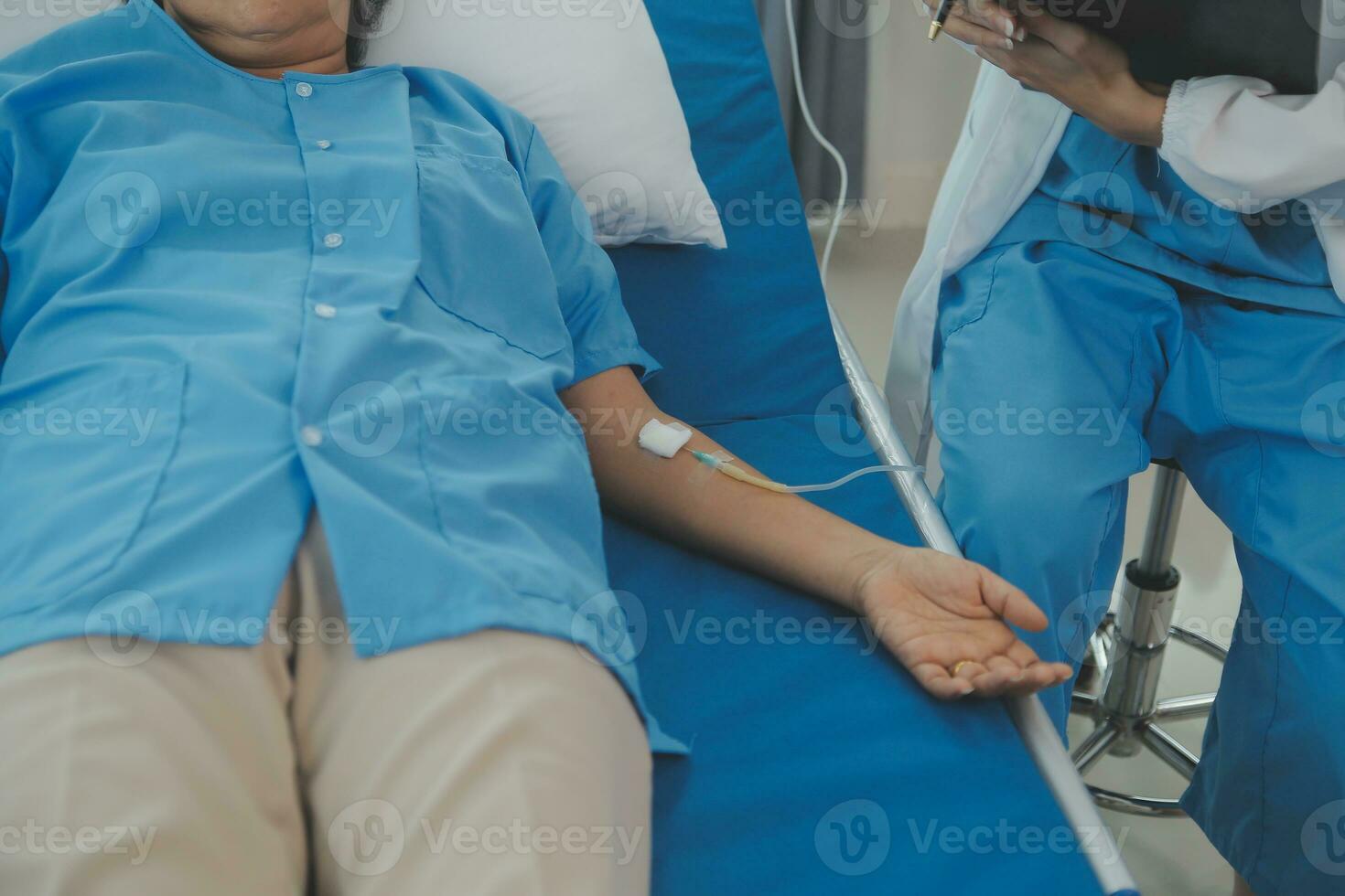 Doctor use stethoscope, checking up heart beat, lunch of auscultation in doctor office at hospital. Patient worker has to get medical checkup every year for her health or medical checkup cardiologist photo
