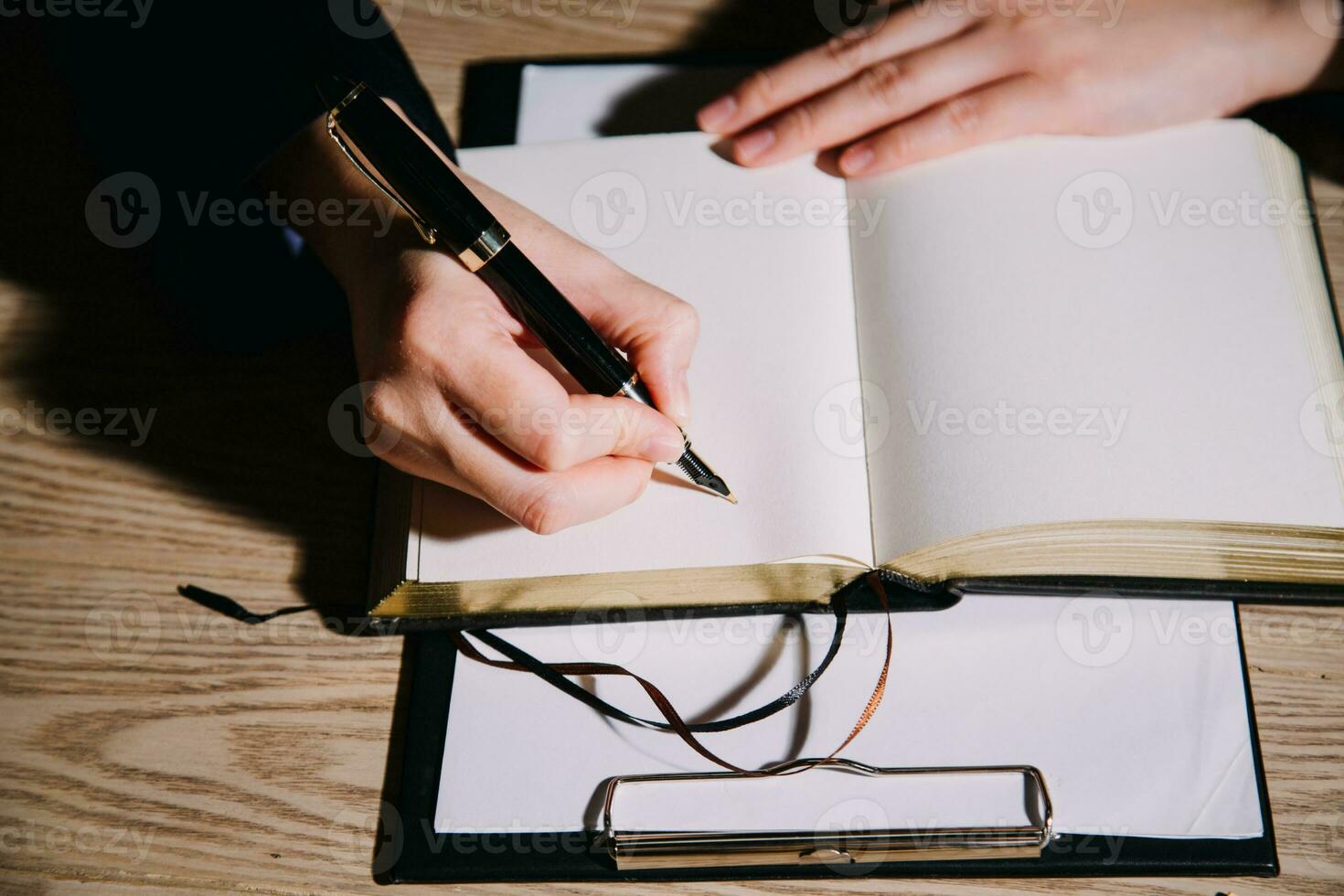 Justice and law concept.Male judge in a courtroom with the gavel, working with, computer and docking keyboard, eyeglasses, on table in morning light photo