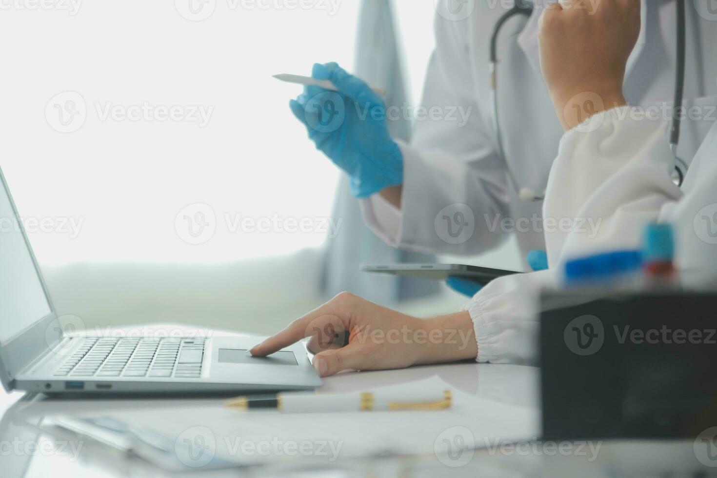 Health care researchers working in life science laboratory. Young female research scientist and senior male supervisor preparing and analyzing microscope slides in research lab. photo