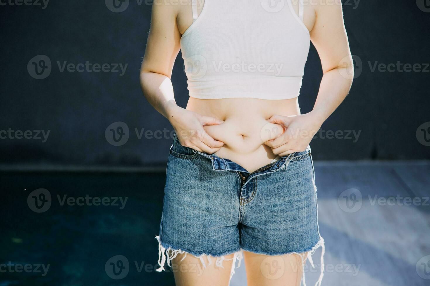 fat woman, fat belly, chubby, obese woman hand holding excessive belly fat with measure tape, woman diet lifestyle concept photo