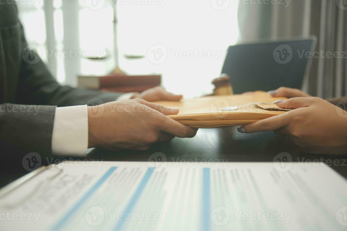 Business and lawyers discussing contract papers with brass scale on desk in office. Law, legal services, advice, justice and law concept picture with film grain effect photo