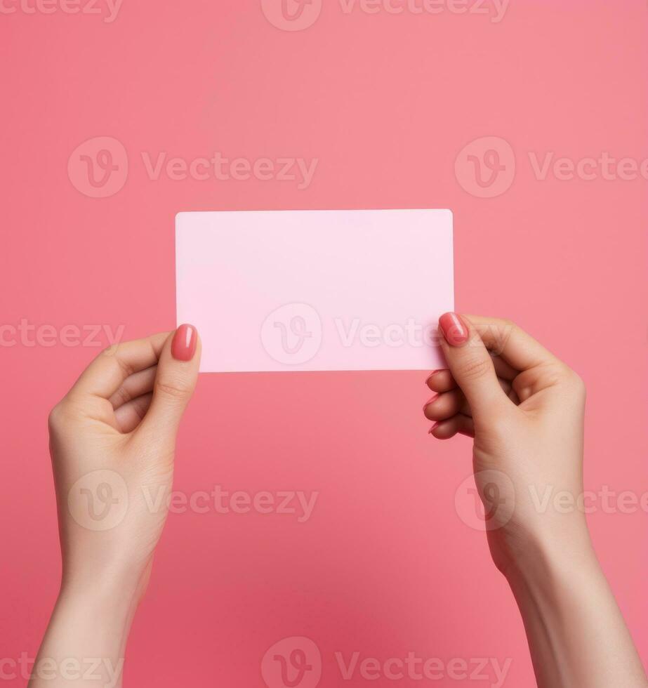 Woman holding pink heart card photo