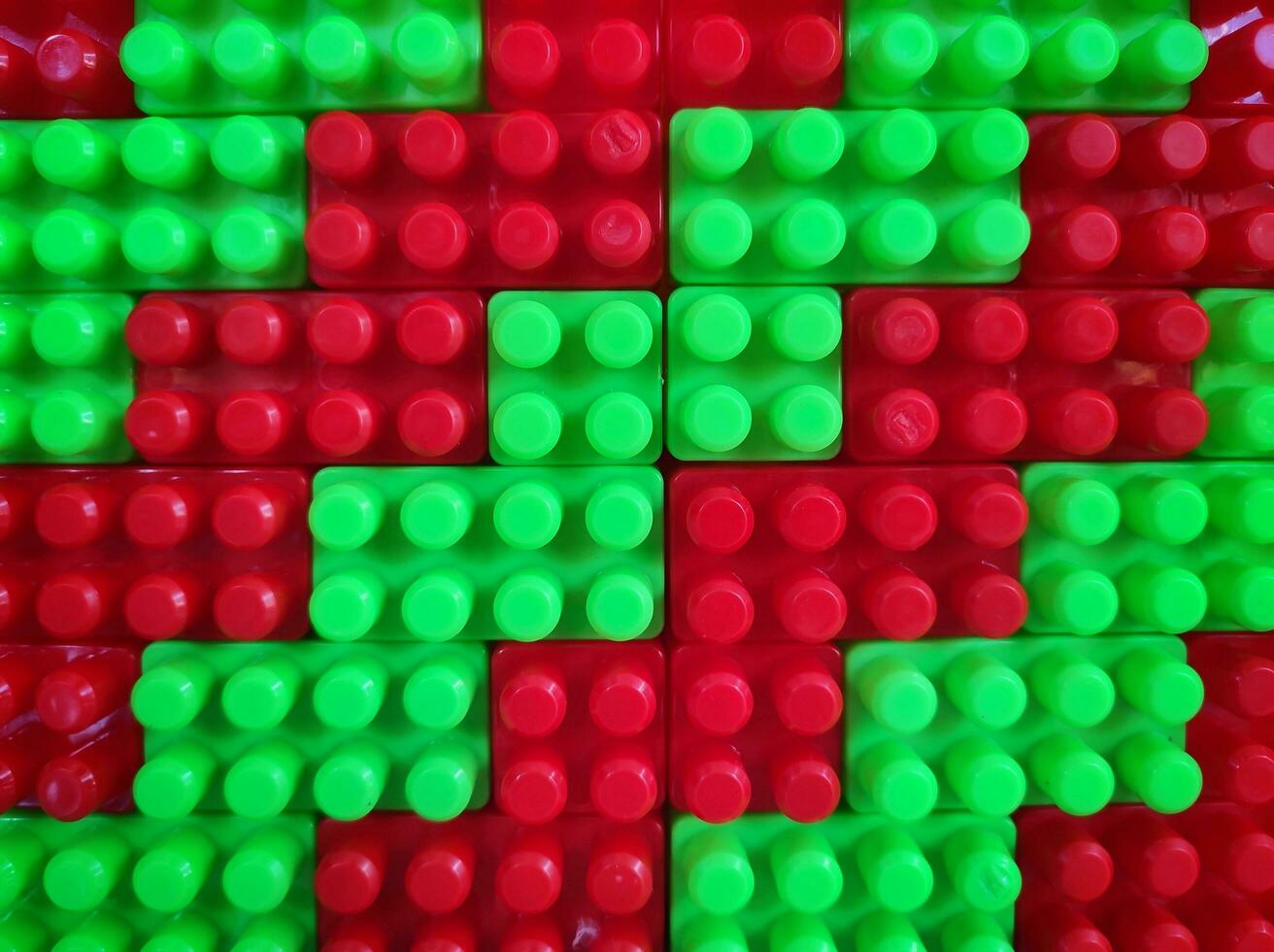 Abstract background pattern of colored building blocks top view. Pattern of plastic part of constructor block puzzle. photo