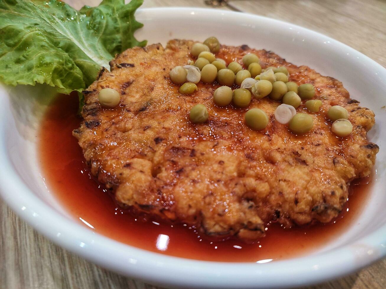 Plate of fuyung hai or Egg foo young. omelette dish found in Chinese Indonesian. photo