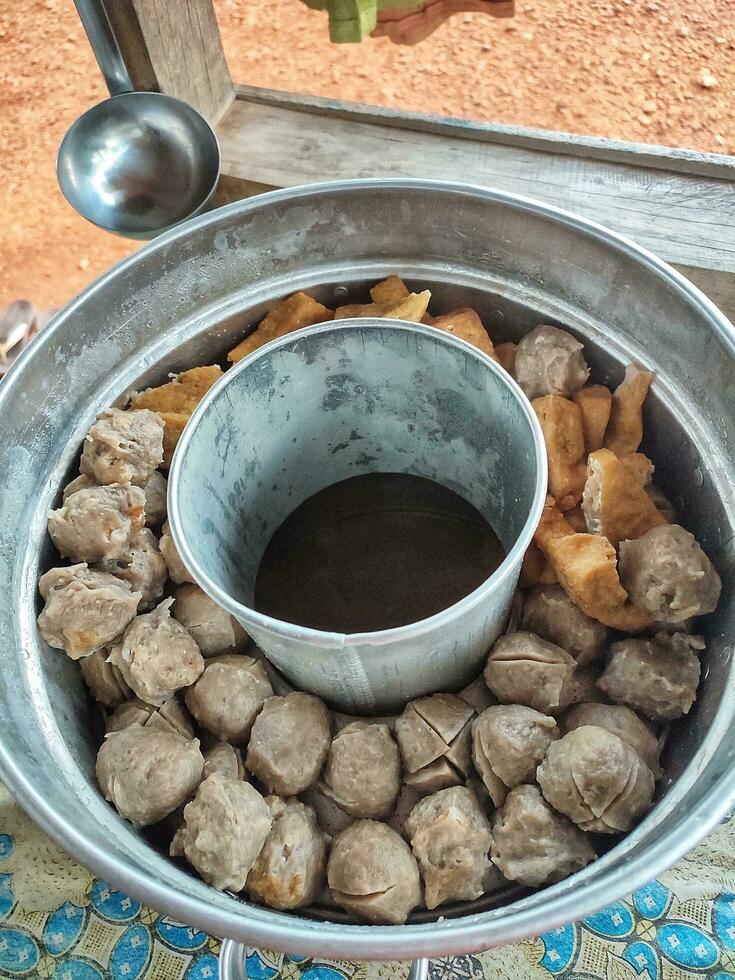 Indonesian culinary snack, a variant of meatballs in a pan cooked and sold around the house. The snack usually called pentol or bakso. photo