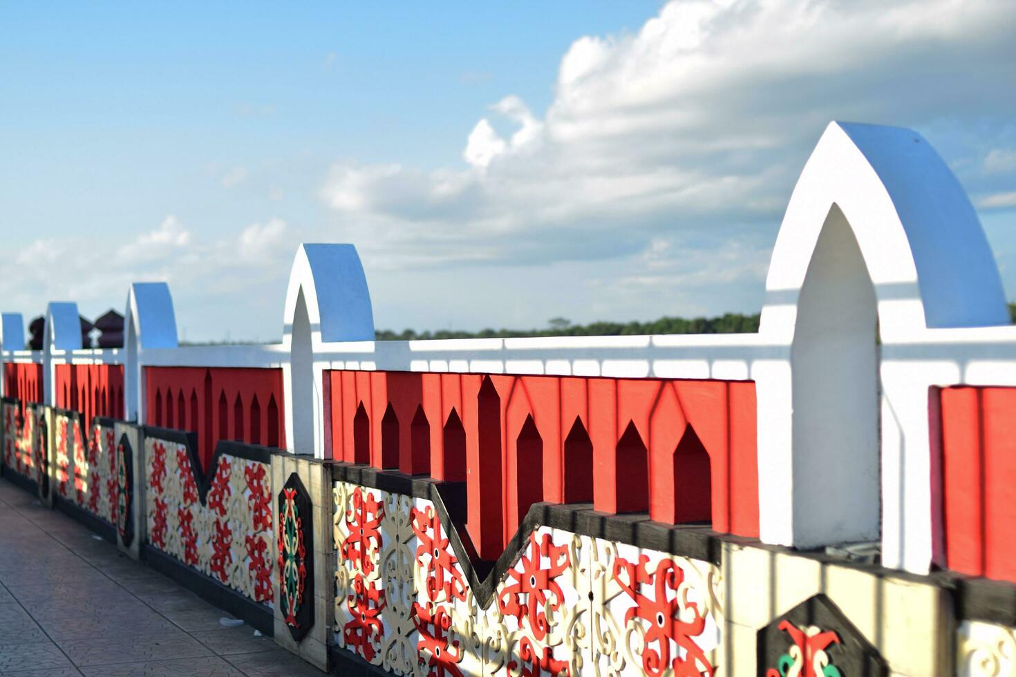 Fences with ornaments are built of concrete. The riverside view was taken in the evening photo