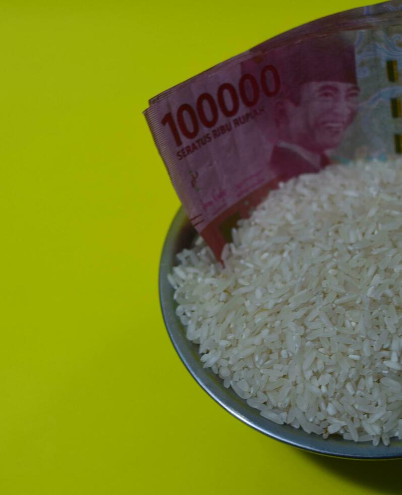 rice with existing Indonesian rupiah cash for zakat concept photo