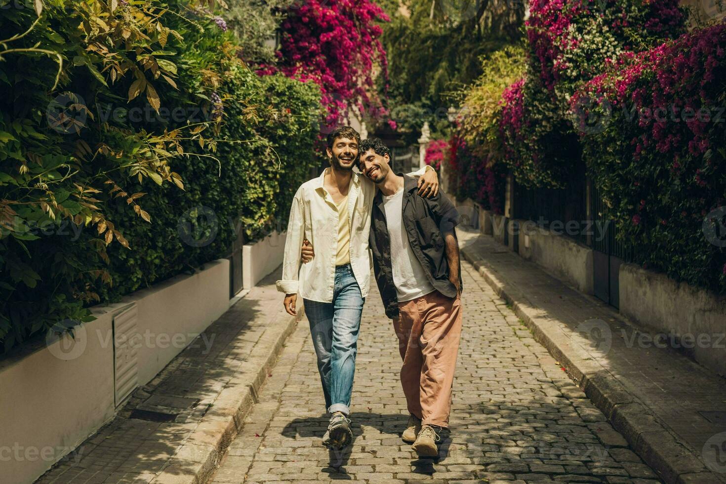 Happy gay couple kissing in the park. LGBT gay couple concept. photo