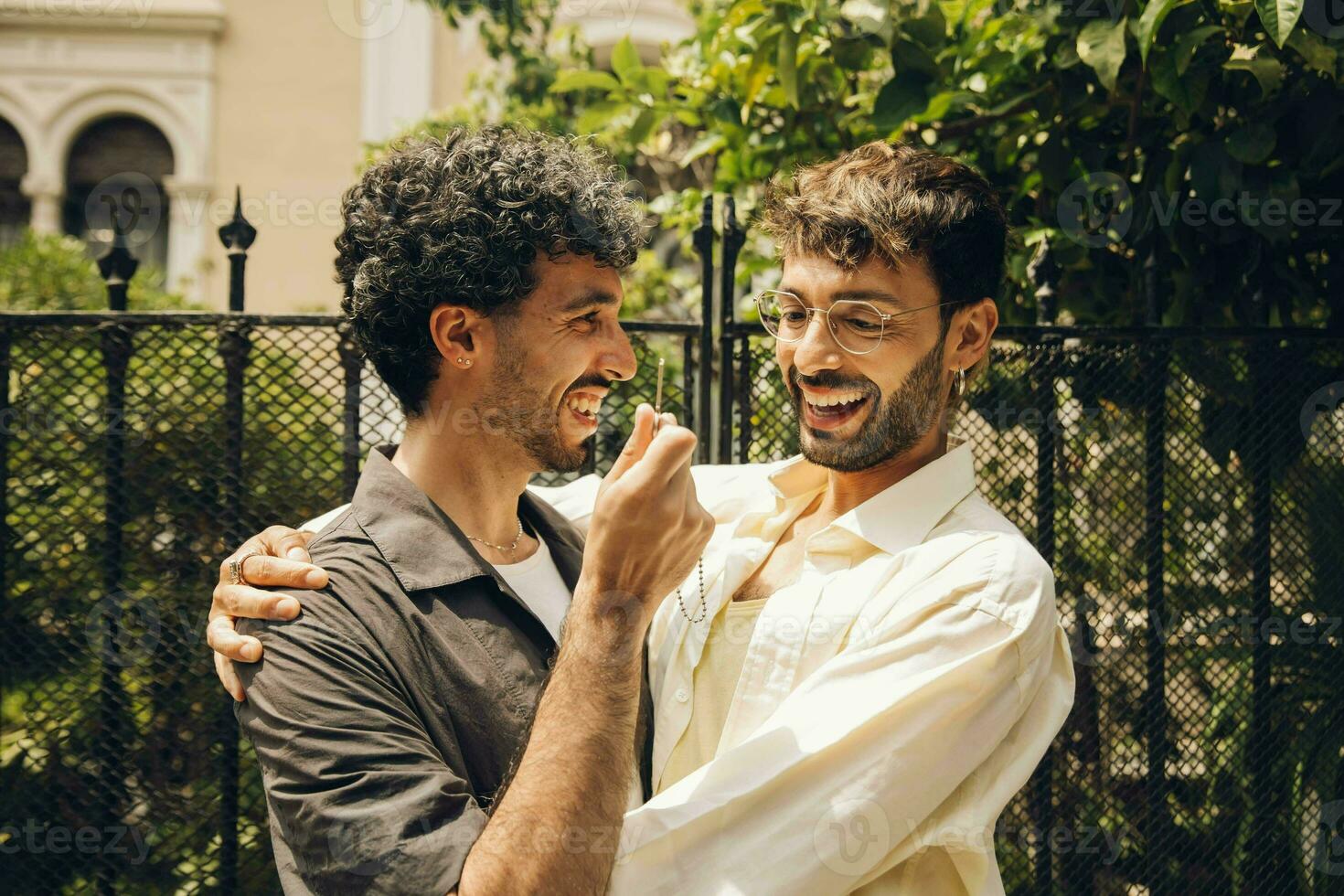 men couple celebrating they are having new home photo