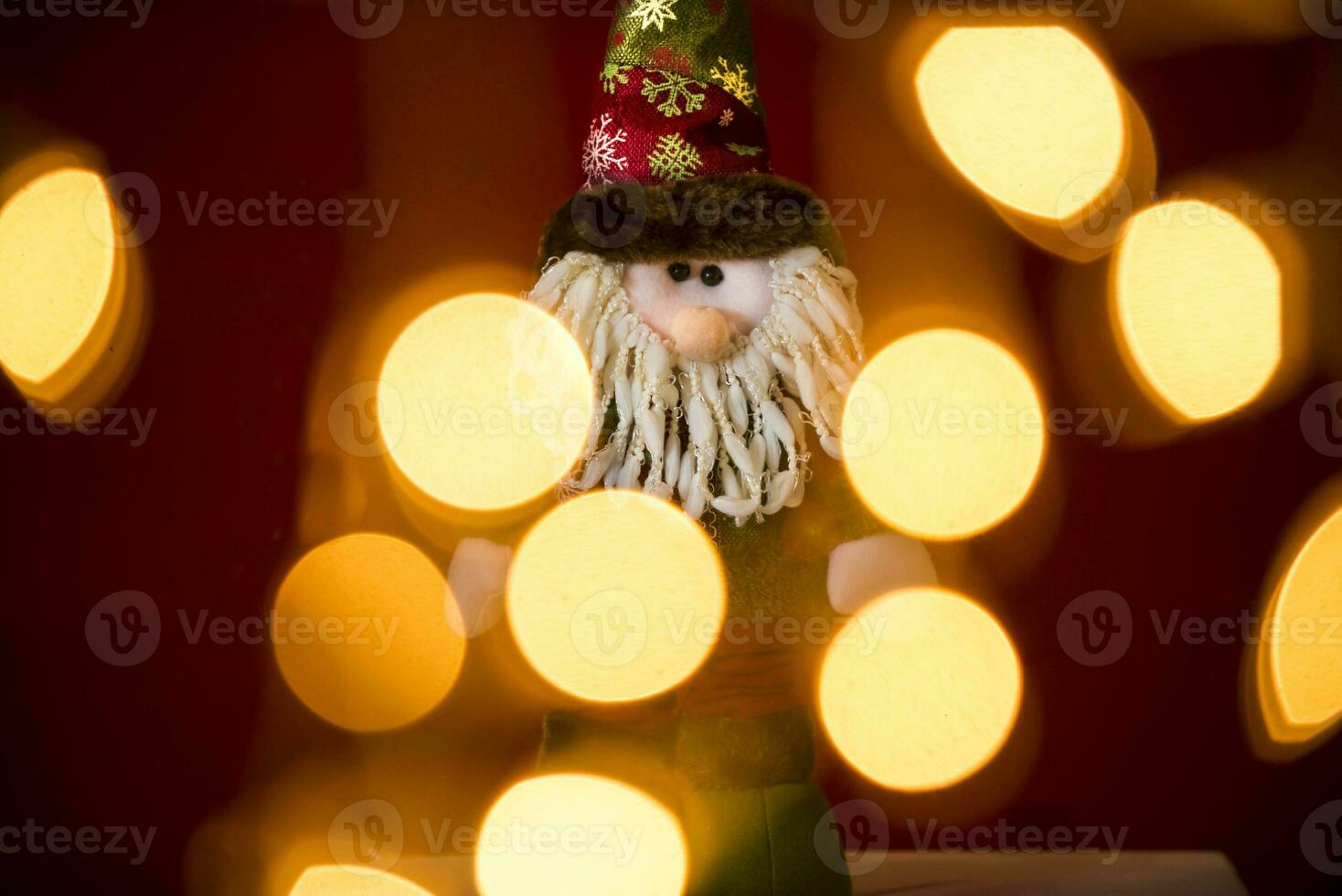 a santa claus doll with a beard and hat photo