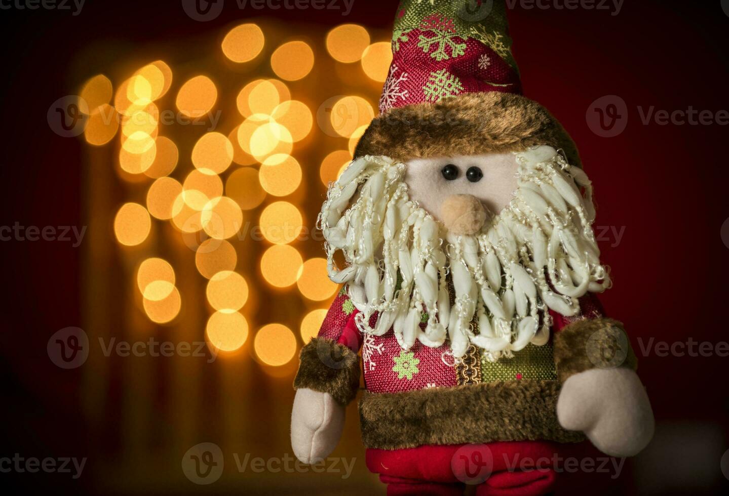 a santa claus doll with a beard and hat photo