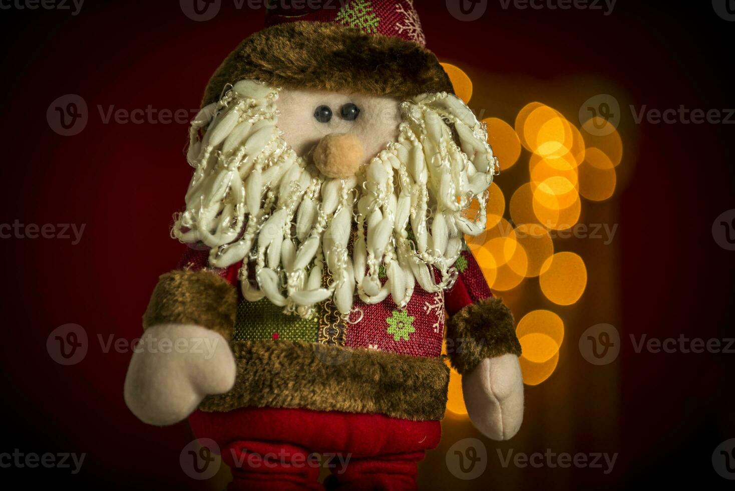 a santa claus doll with a beard and hat photo