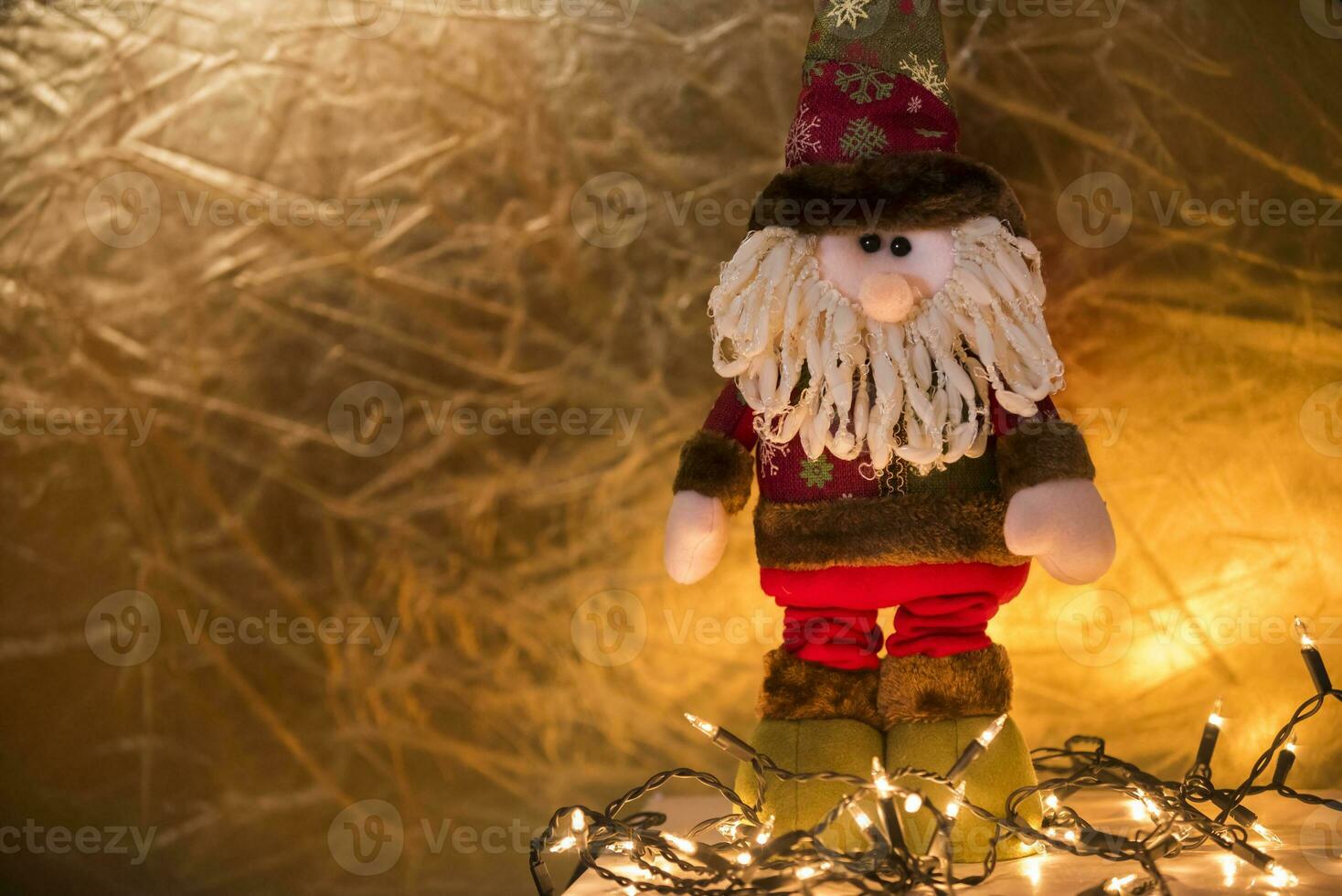 a santa claus doll with a beard and hat photo