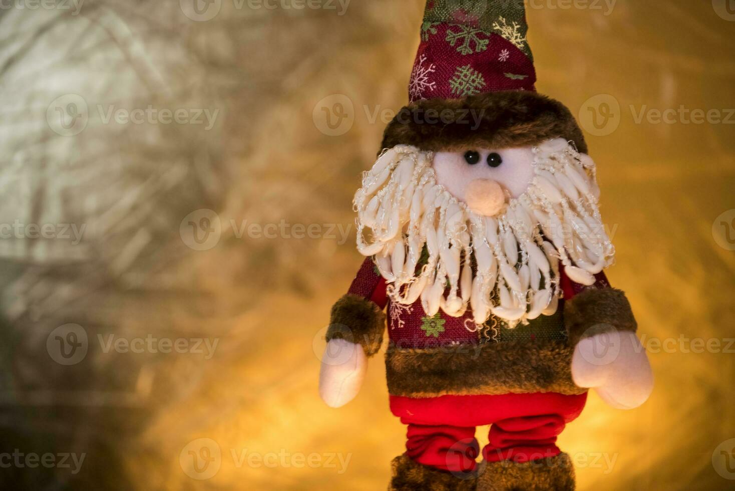 a santa claus doll with a beard and hat photo