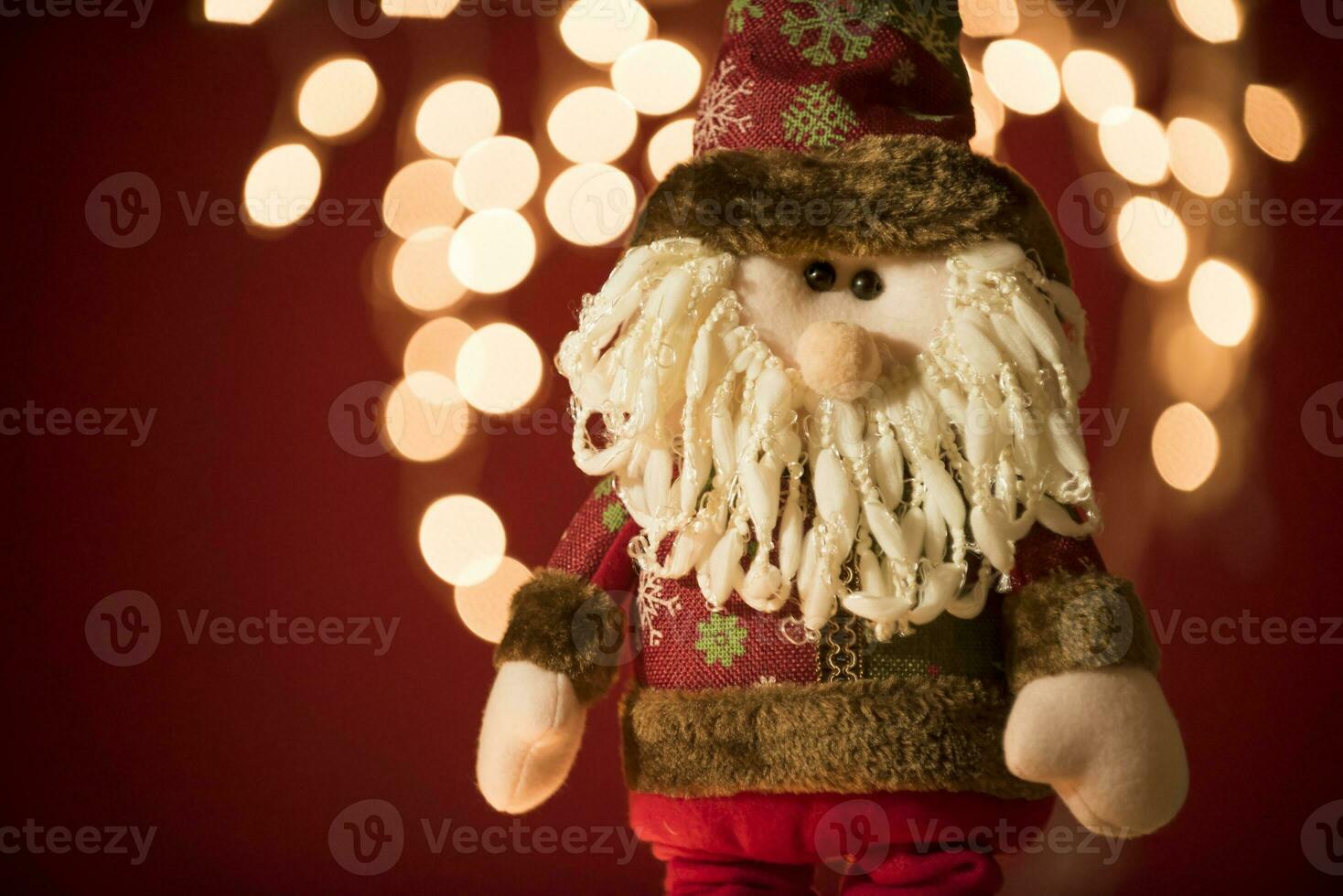 a santa claus doll with a beard and hat photo