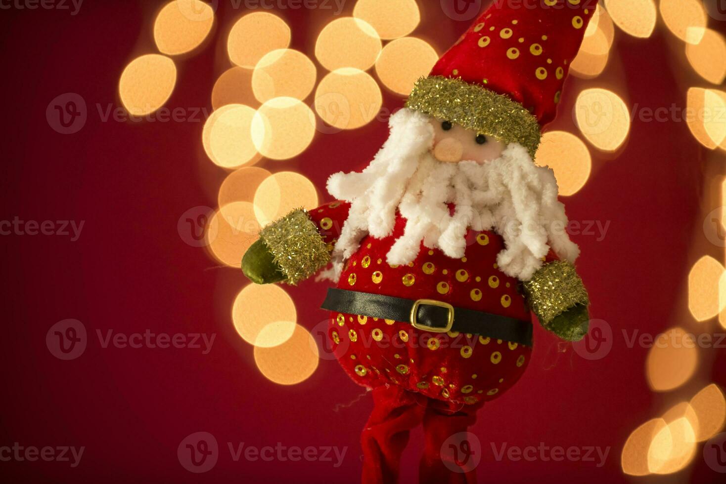 a santa claus doll with a beard and hat photo