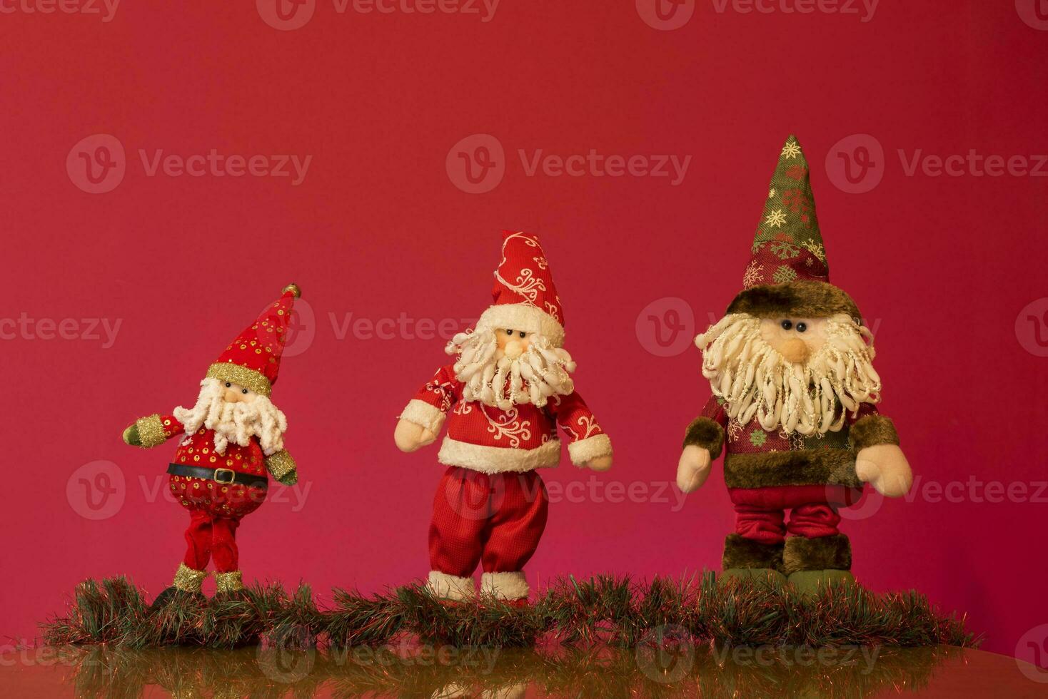 a santa claus doll with a beard and hat photo