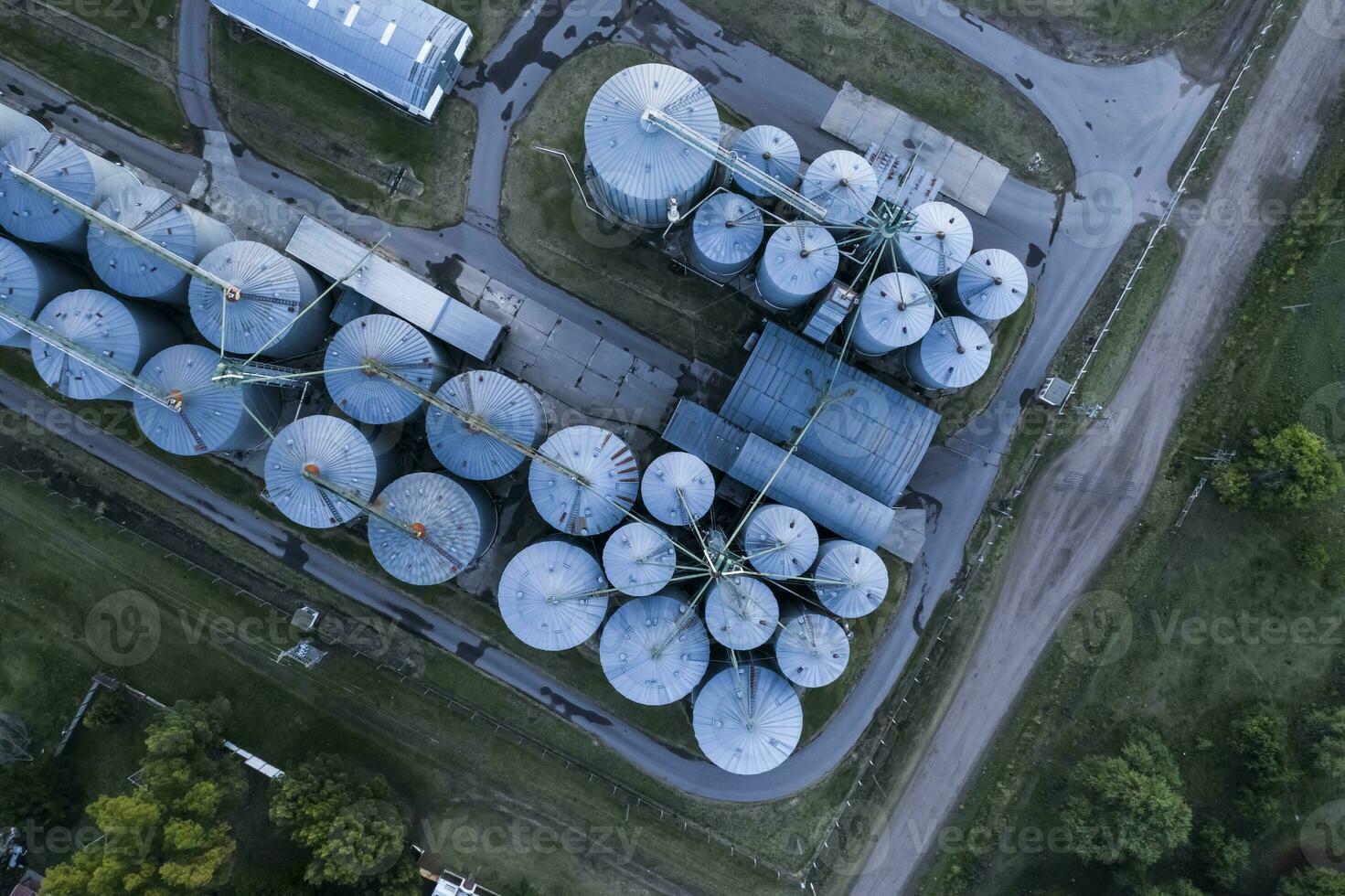 an aerial view of a grain silo at sunset photo