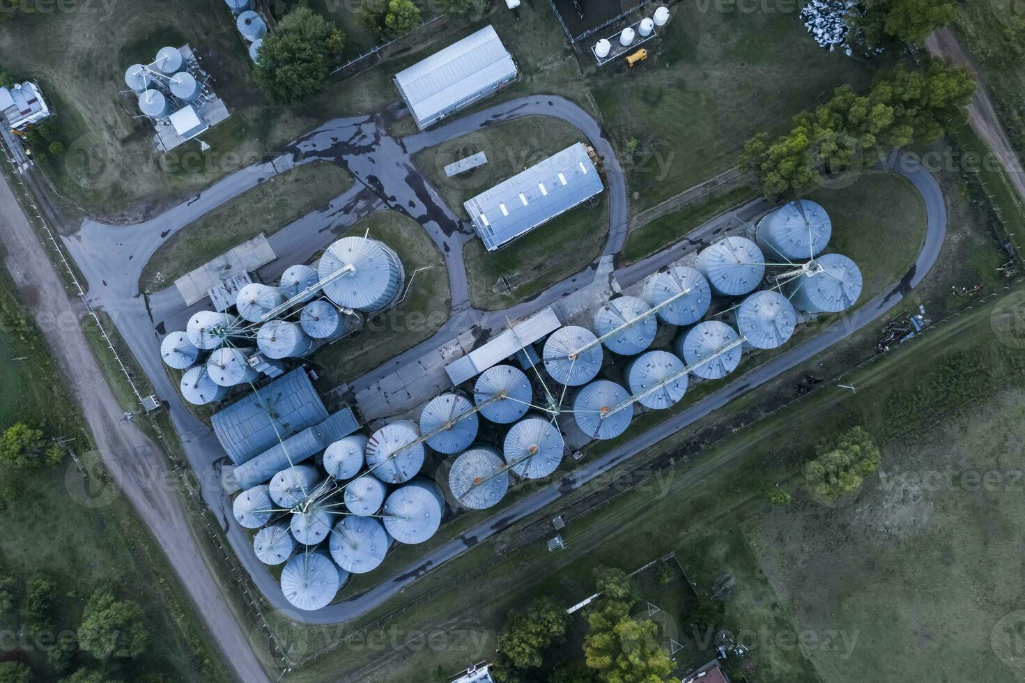 an aerial view of a grain silo at sunset photo