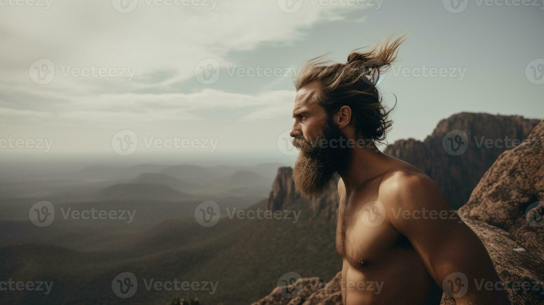 Young adult with beard enjoying countryside, blue sky, leisure activity, freedom, happiness. photo