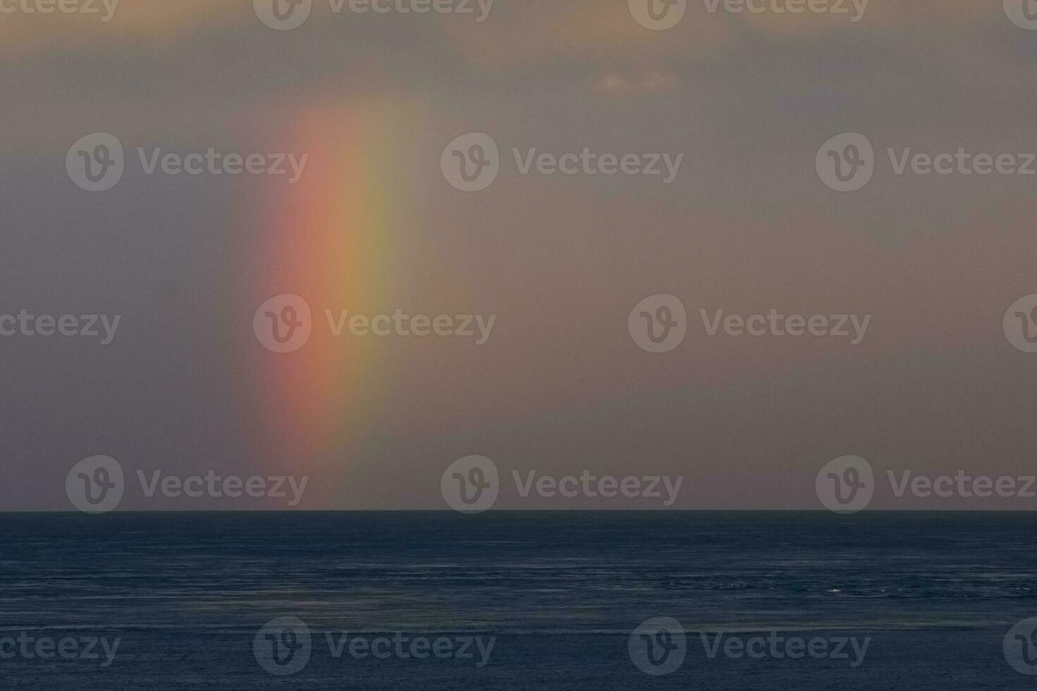 rainbow over the ocean photo