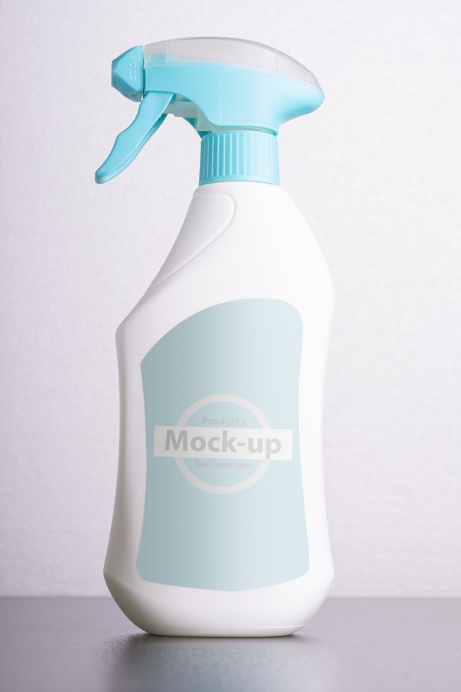 Cleaning liquid bottle in front of  light gray background psd