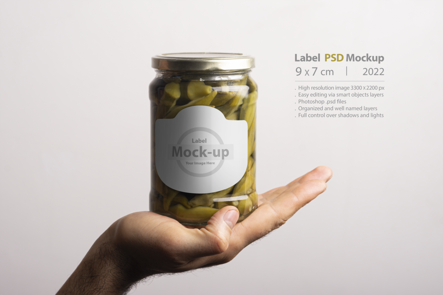Pickled okra conserve with round cap inside hand psd