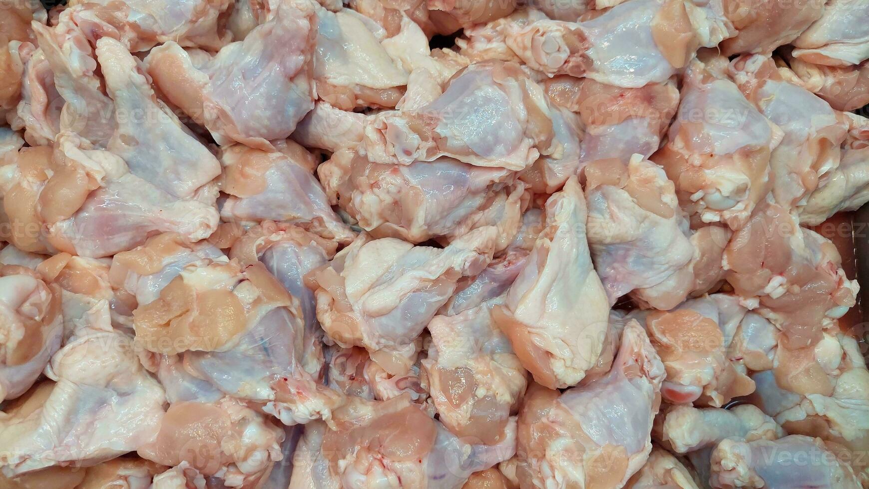 Fresh chicken joints in a tray ready for sale photo