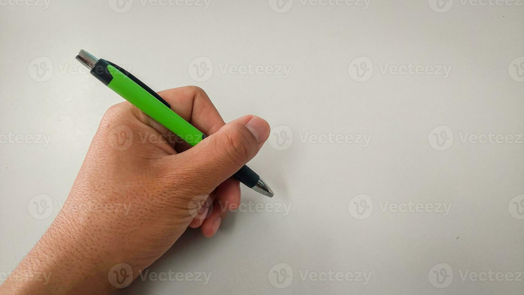 Hand writting on a glass by a felt tip pen isolated on white background photo