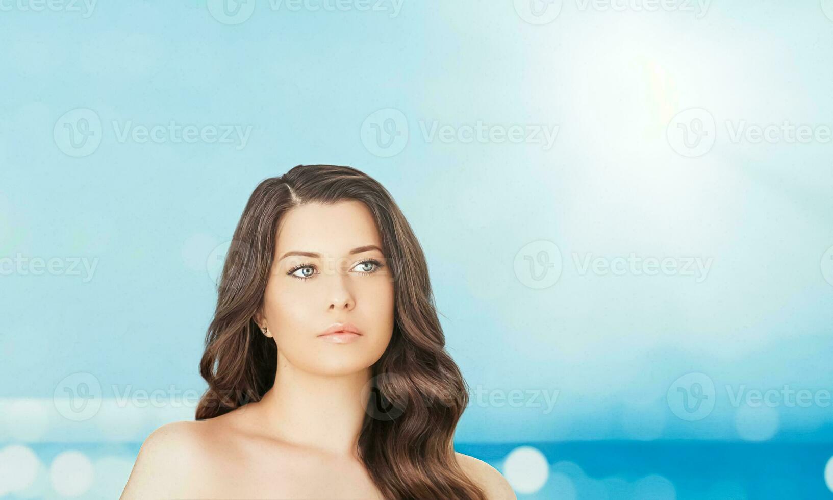 Wellness model and beauty face closeup. Beautiful brunette woman with natural organic cosmetics makeup and long hairstyle as spa, skincare and glamour portrait photo