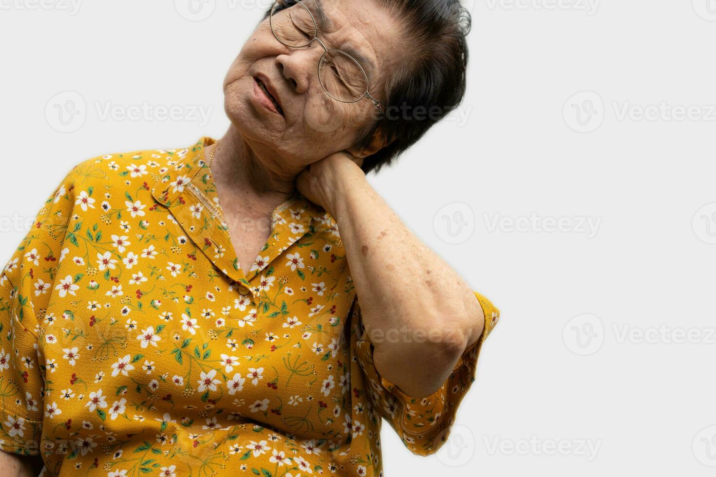 Sick senior woman with back neck and shoulders pain on the joint and muscle. Close-up of wrinkled hands rubbing their neck-collar area, osteoarthritis, neurological diseases. Medicine concept photo