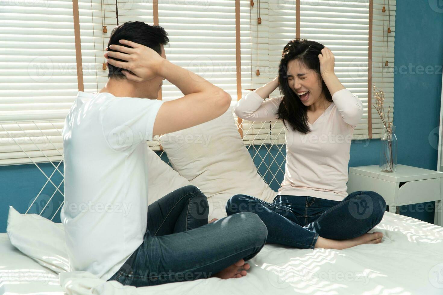 Unhappy Couple sitting beside each other on the floor and avoid talking or quarrel, Cause of relationship problems and having misunderstanding or disagreement. Family problems concept photo