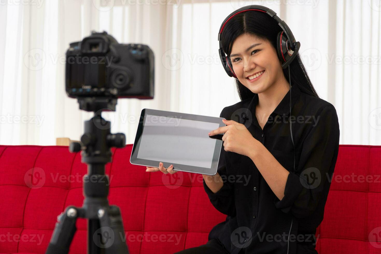 Vlog Asian woman blogger influencer sitting on the sofa in home and recording video blog for teaching and coach her Students or subscriber. Concept of the content creator online for a new lifestyle photo