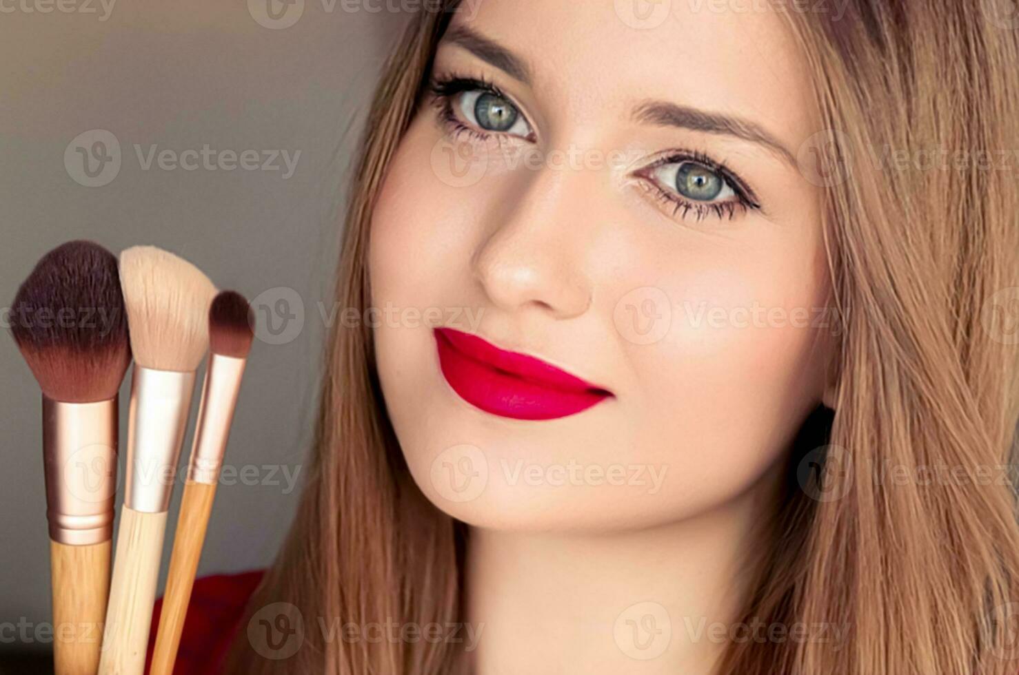 Beauty, makeup and cosmetics, face portrait of beautiful woman with make-up brushes, luxury cosmetic product, makeup artist or beauty blogger concept photo