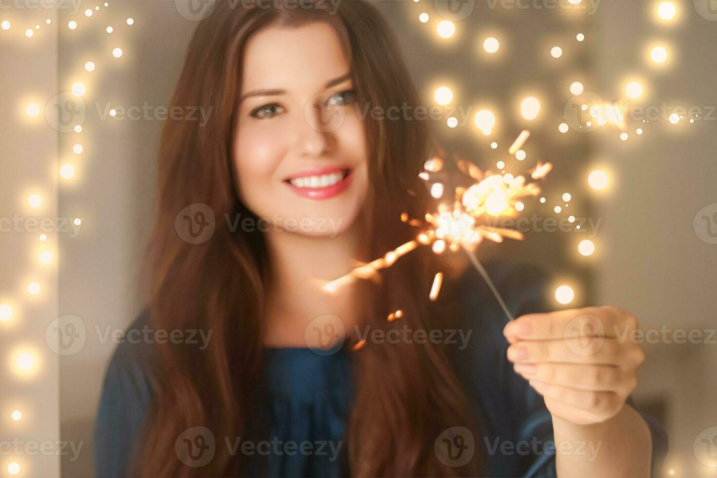 Holiday magic, Christmas and New Year celebration, happy woman with sparklers photo