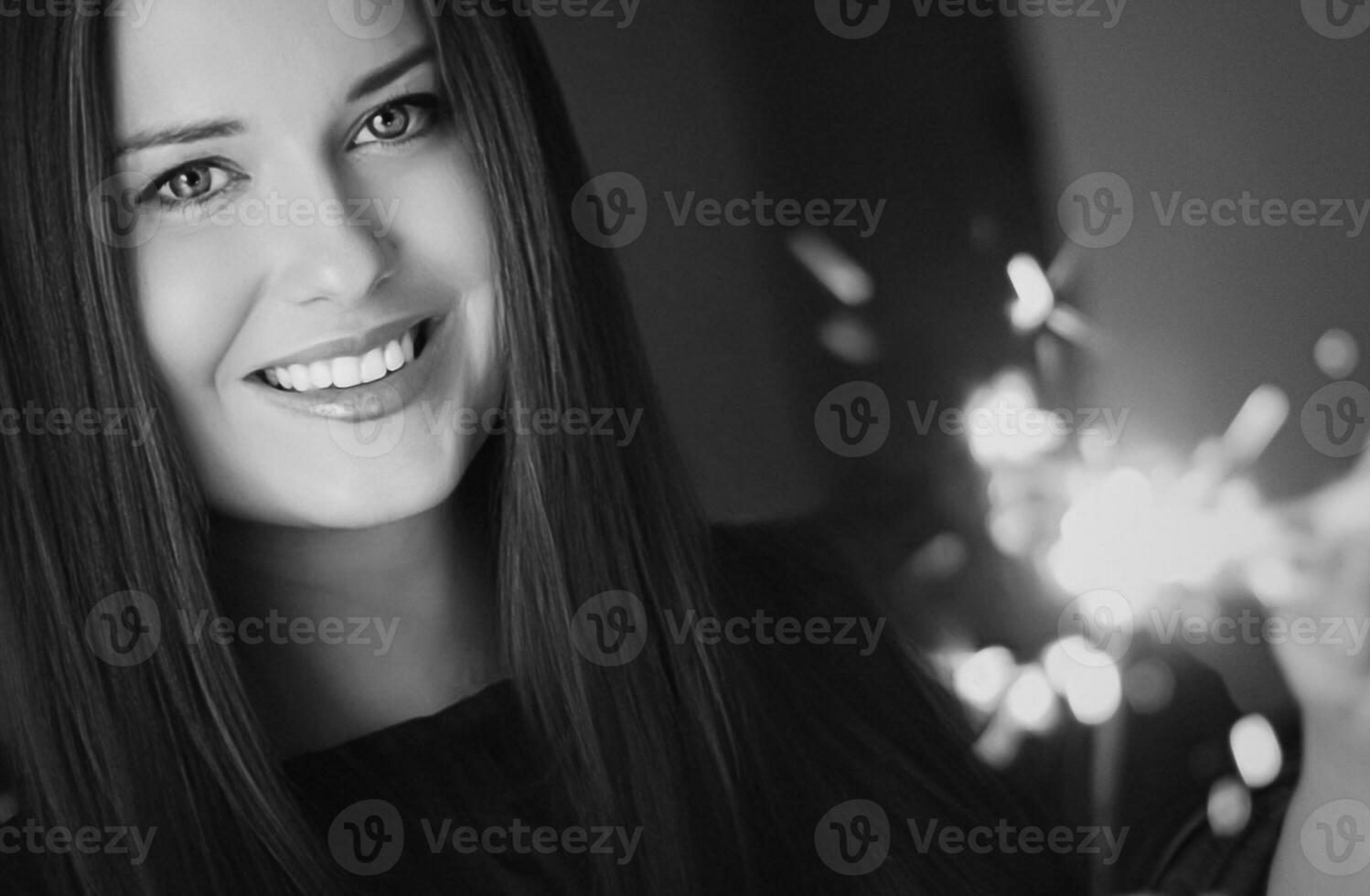 Holiday magic, Christmas and New Year celebration, happy woman with sparklers photo