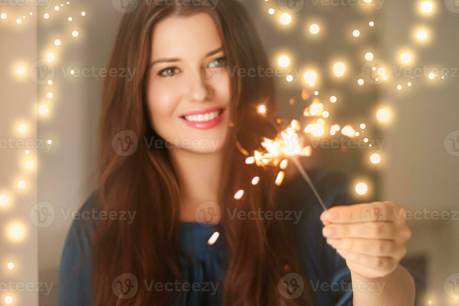 Holiday magic, Christmas and New Year celebration, happy woman with sparklers photo
