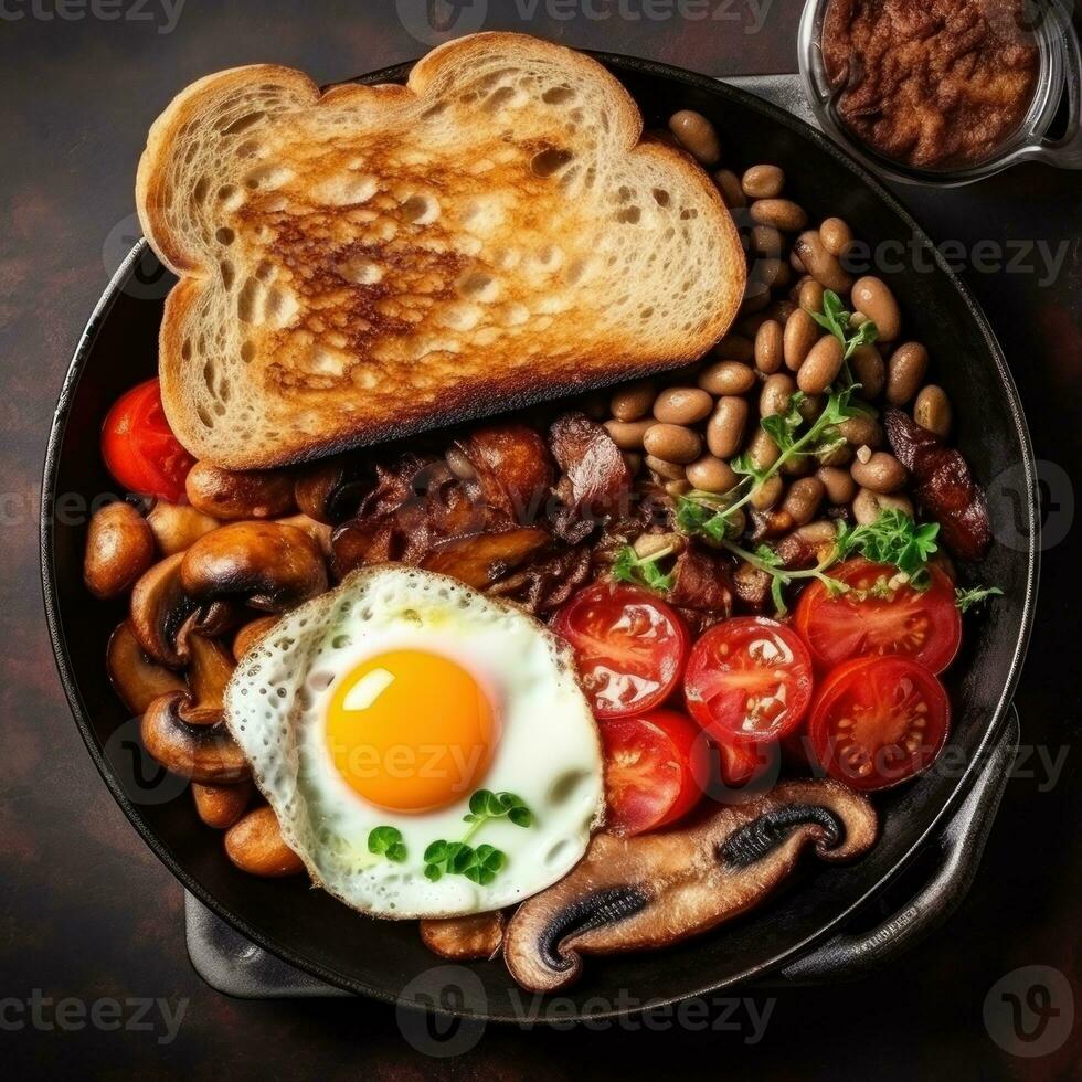 English breakfast with eggs, bacon and beans photo