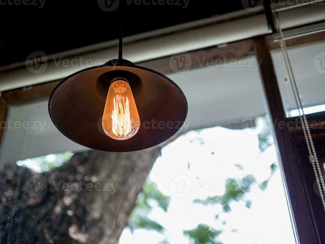 Hanging lamp by the window photo