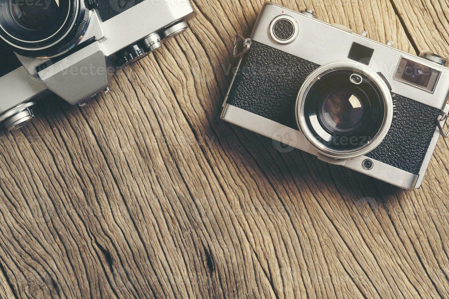 vintage old film camera on wood board photo