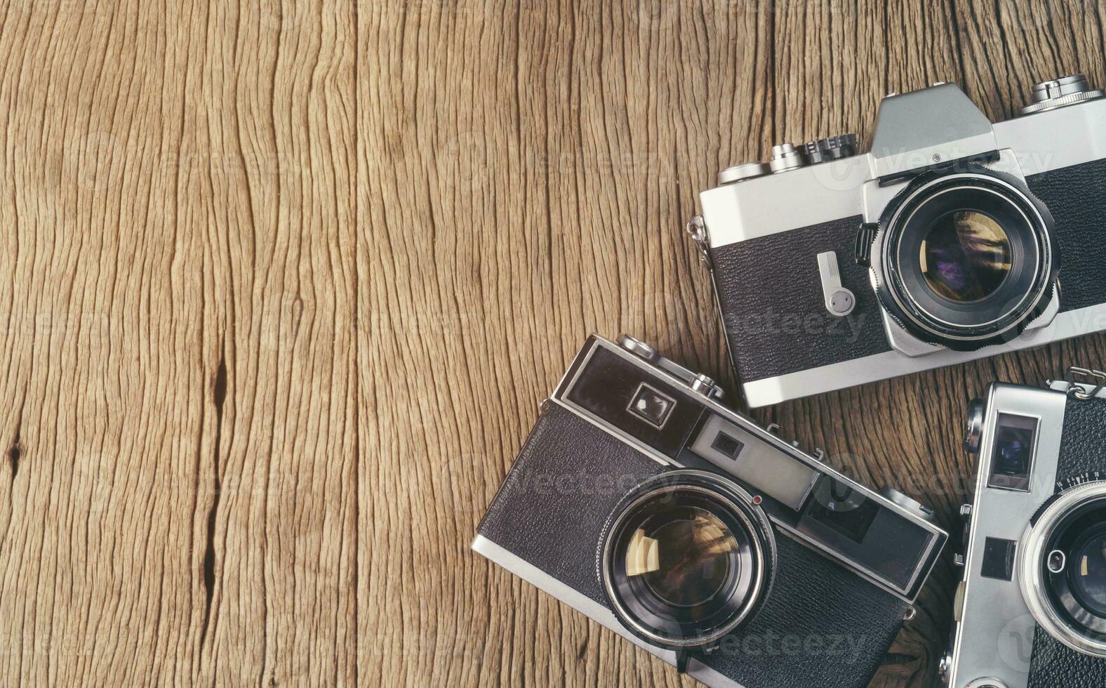 vintage old film camera on wood board photo