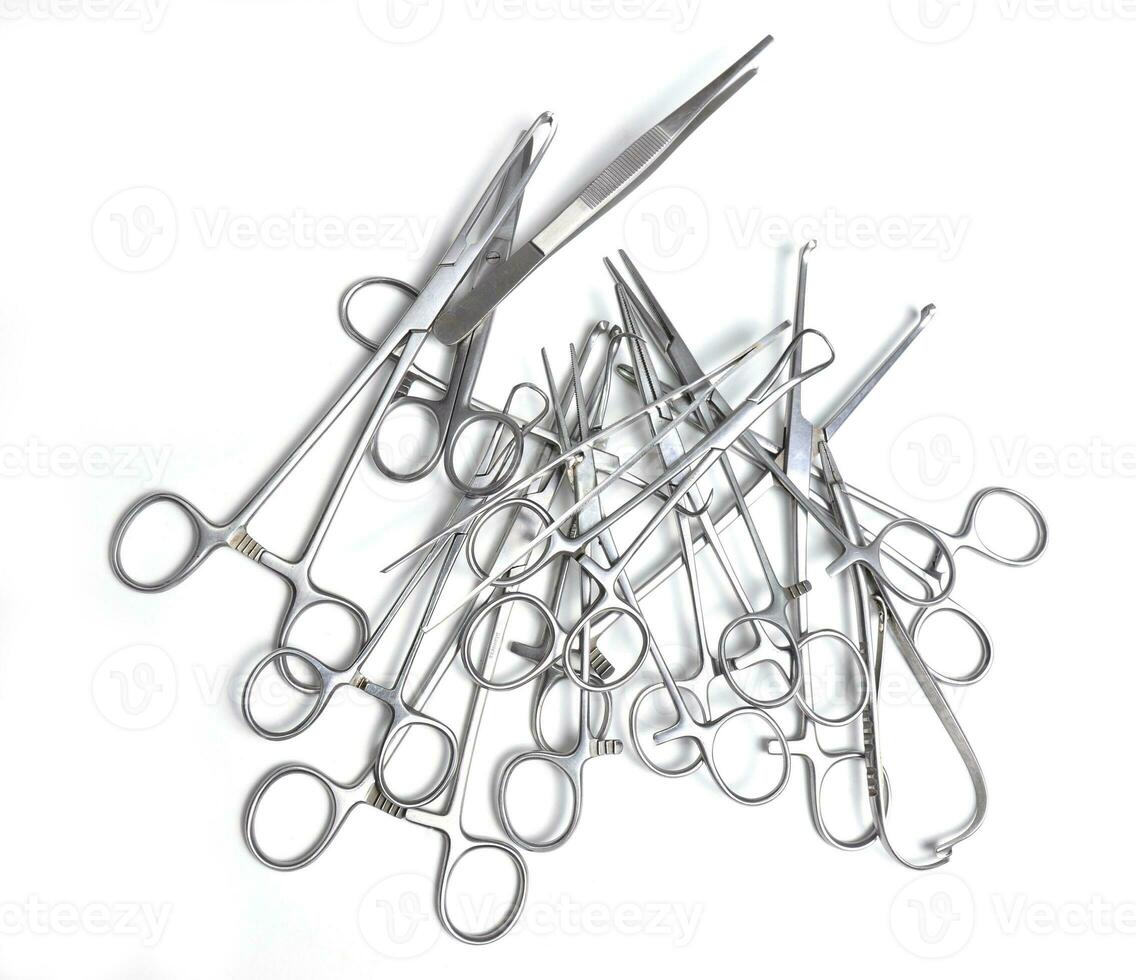 Surgical instruments on white background photo