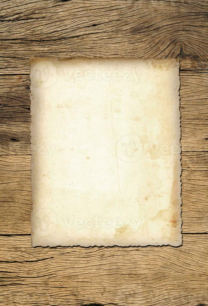 Old paper texture background on wood board photo