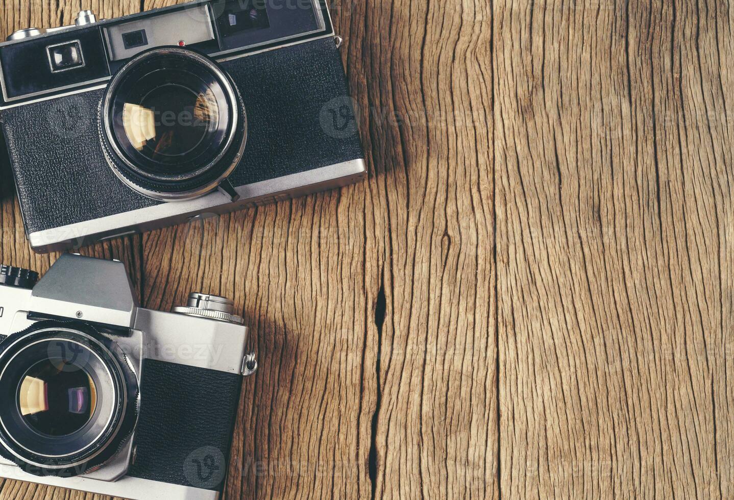 vintage old film camera on wood board photo