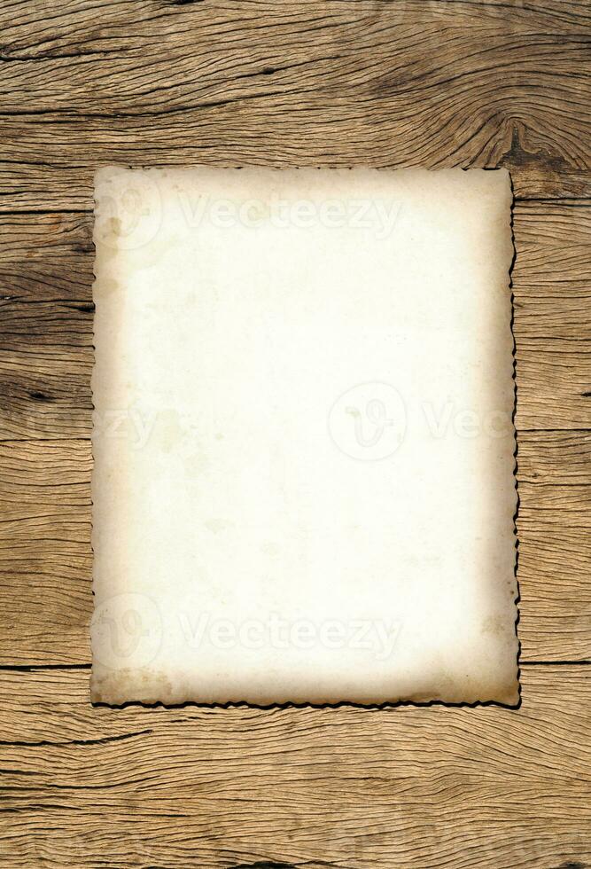 Old paper texture background on wood board photo