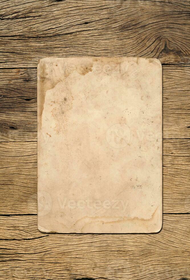 Old paper texture background on wood board photo