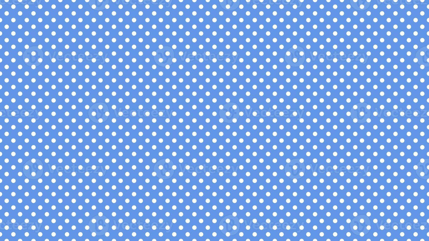 white polka dots over cornflower blue background photo