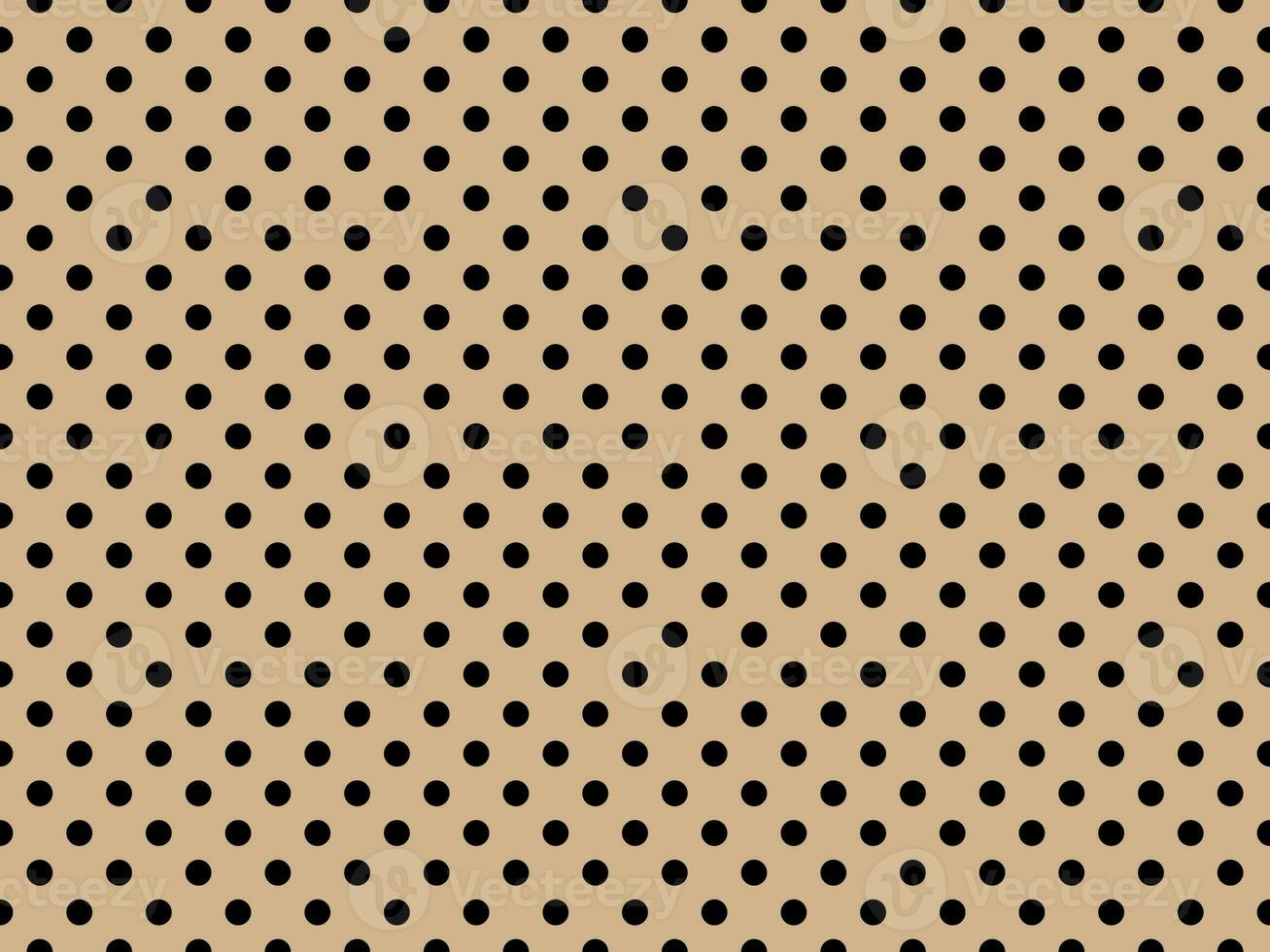 black polka dots over tan background photo