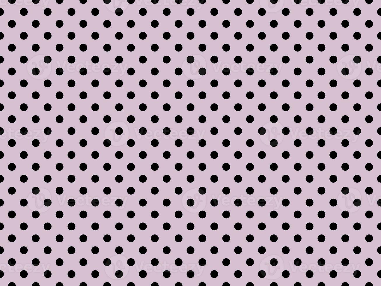 black polka dots over thistle background photo